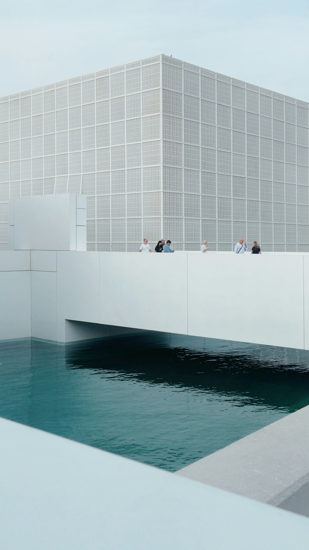 a-group-of-people-standing-on-a-bridge-over-a-body-of-water-cehb8p7n-08